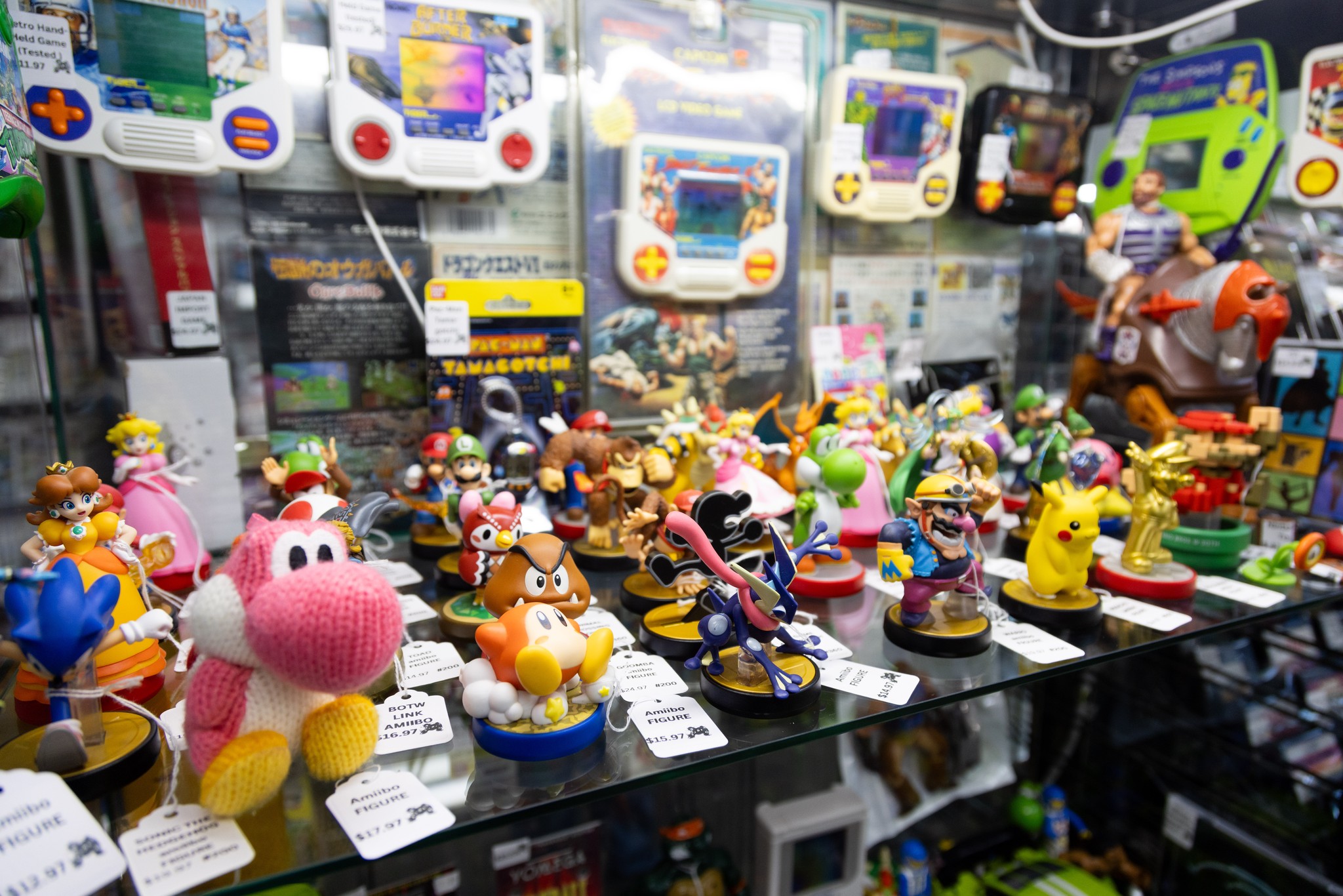 Amiibo and other toys on a shelf in Secret Level